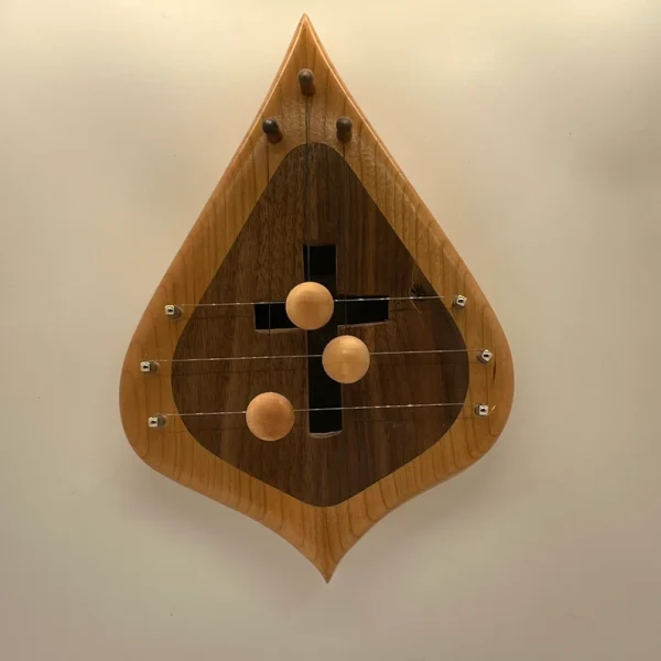 D3CBWSIMX-3 string door harp with Cherry border and simple Walnut inlay. Sound hole is shaped like a cross!