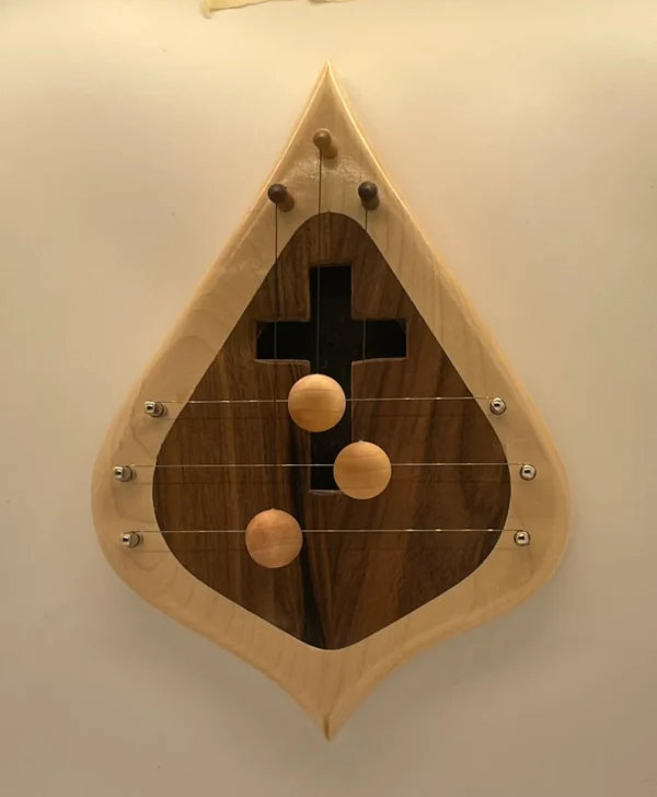 DH3MBWSIMX-3 String Door Harp with solid Maple border and solid Walnut inlay. Inlay has a cross shaped sound hole.